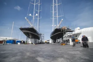 Port Denia shipyard dry docking area and two sailing yachts